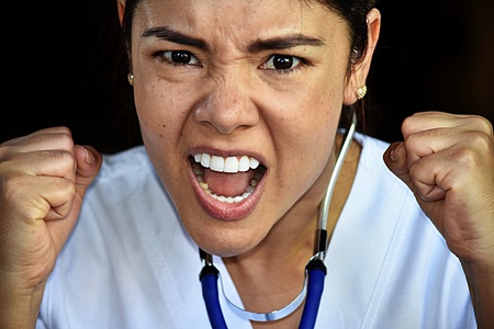Mad Latina Female Nurse Medical Professional Wearing Scrubsの写真素材