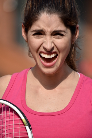 Stressful Athlete Colombian Female Tennis Player With Tennis Racketの写真素材