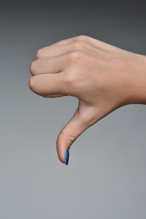 Female Teen Hand Thumbs Down