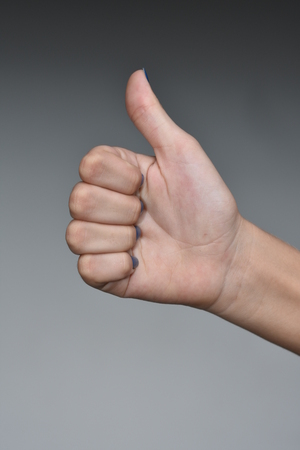 Female Teen Hand Thumbs Up