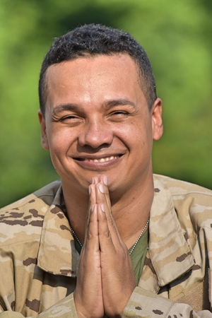Hispanic Male Soldier Prayingの写真素材