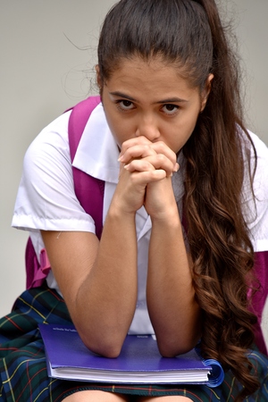 Student Teenager School Girl Praying Wearing School Uniformの写真素材
