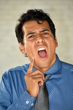 Latino Business Man With Toothacheの写真素材