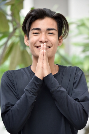 Handsome Filipino Man Prayingの写真素材