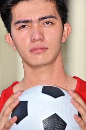 Serious Athlete Diverse Person With Soccer Ballの写真素材