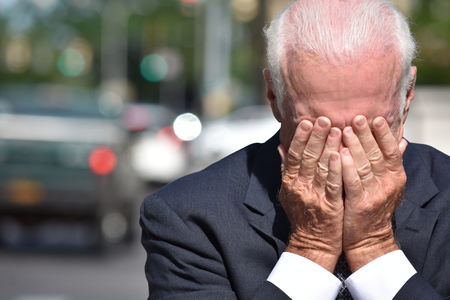 Sad Adult Senior Person Wearing Suit And Tie Downtown