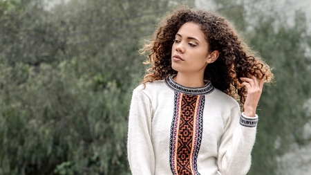 Contemplative Cute Peruvian Person Wearing Winter Clothesの写真素材