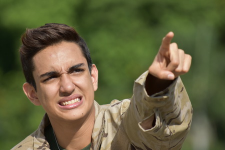 Young Male Soldier Pointingの写真素材