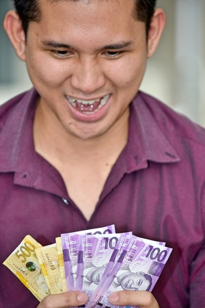 Adult Male Counting Moneyの写真素材