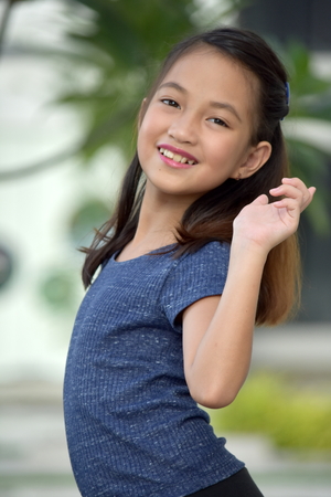 Asian girl posing in front of camera close up.の写真素材