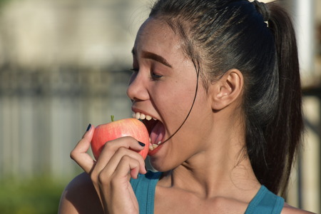 Beautiful Minority Female Eatingの写真素材