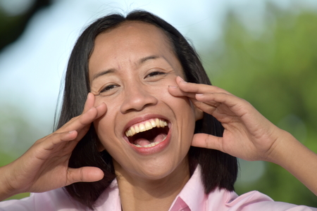 Youthful Filipina Female Singingの写真素材