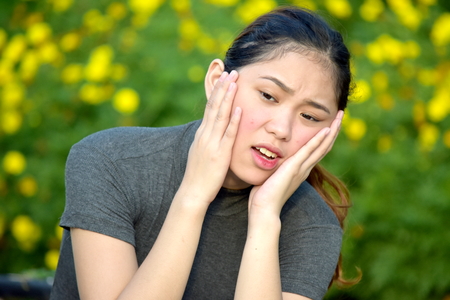 Startled Young Filipina Female Womanの写真素材