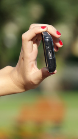 Female Hand Taking Photo With Phoneの写真素材