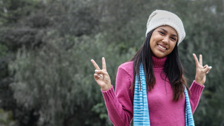 Cute Peruvian Female And Peace Signの写真素材