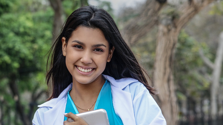 Peruvian Female Doctor Smiling Wearing Lab Coatの写真素材
