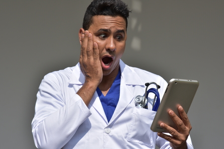 Shocked Smart Colombian Person With Tabletの写真素材