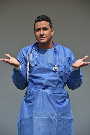 Confused Young Male Surgeonの写真素材