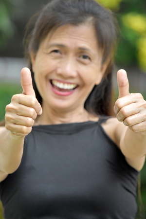 Senior Diverse Grandmother With Thumbs Upの写真素材