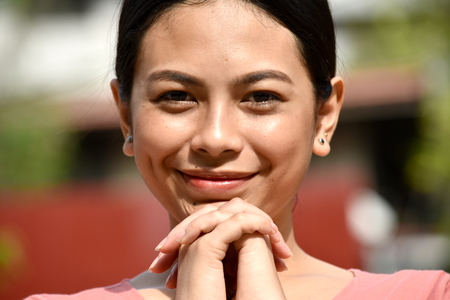 Youthful Filipina Female Prayingの写真素材