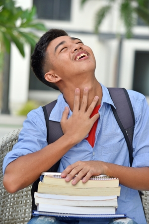 Happy Youthful Filipino Boy Studentの写真素材