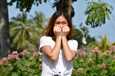 Youthful Filipina Female And Fearの写真素材