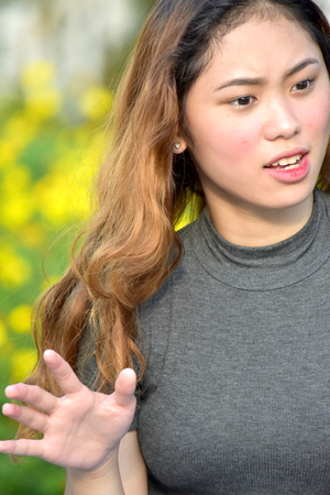 Fearful Young Asian Adult Femaleの写真素材