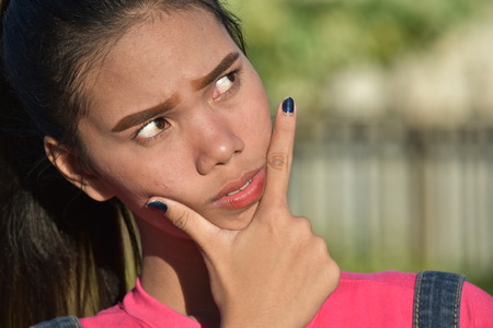 Beautiful Asian Female Making A Decision