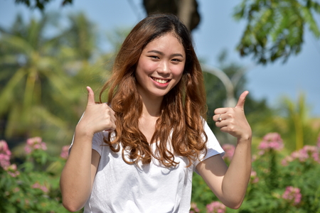 Female With Thumbs Upの写真素材