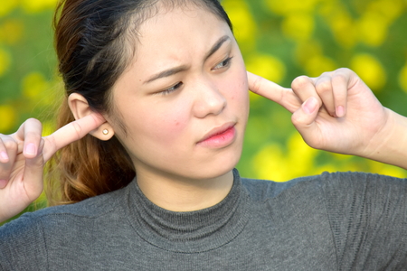 Silent Youthful Asian Femaleの写真素材