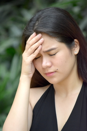 Worried Youthful Asian Femaleの写真素材