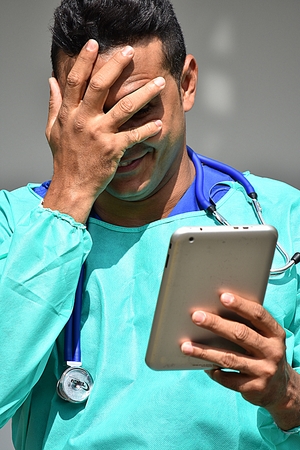 Handsome Male Doctor Under Stressの写真素材