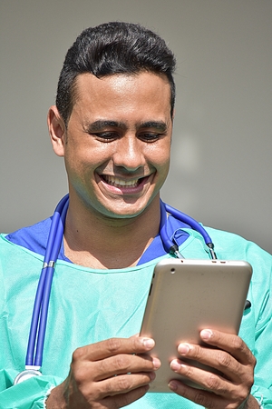 Happy Male Medic Wearing Scrubsの写真素材