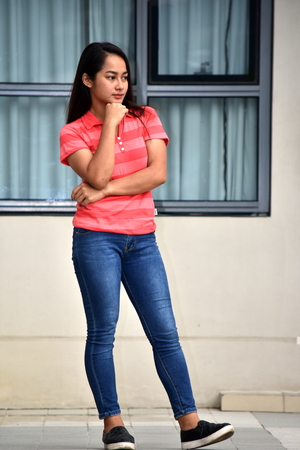 Asian Female Thinking Standingの写真素材
