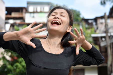 Retired Asian Female Senior And Laughterの写真素材