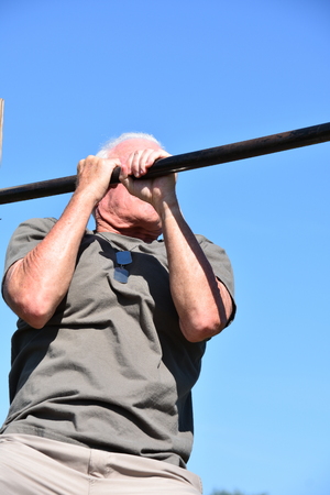 Military Senior Male Veteran And Muscles Exercisingの写真素材