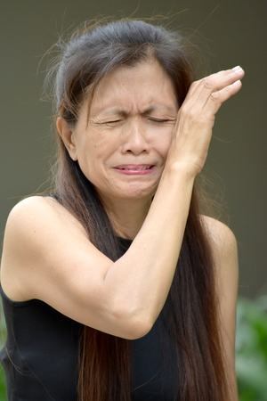 Tearful Retired Minority Female Seniorの写真素材