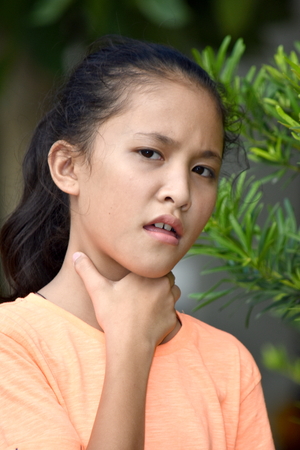 Young Teenage Female With Sore Throatの写真素材