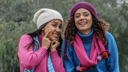 Cute Female Girl Friends In Winterの写真素材