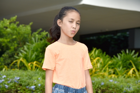 Filipina Teenage Female Winkingの写真素材