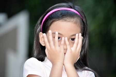 Ashamed Cute Asian Female Tweenの写真素材