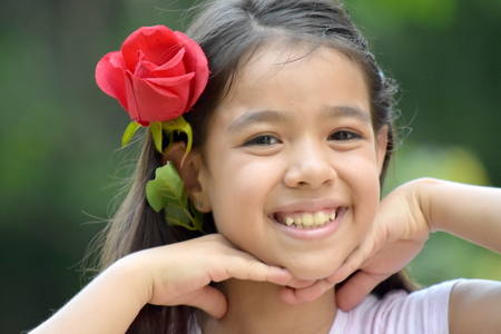 Smiling Minority Female With A Roseの写真素材