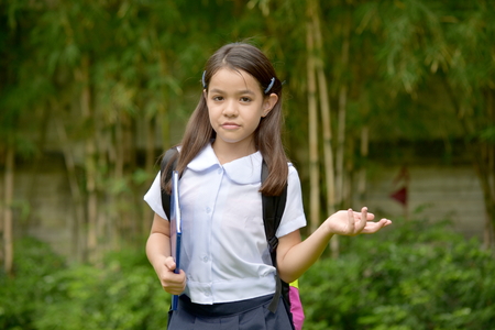 Undecided Cute Minority Person With Notebooksの写真素材