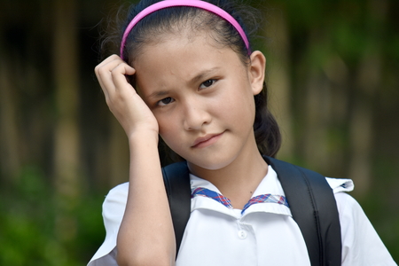 Worried School Girl With Booksの写真素材