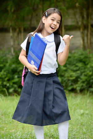 School Girl And Happiness Wearing Uniform With Notebooksの写真素材