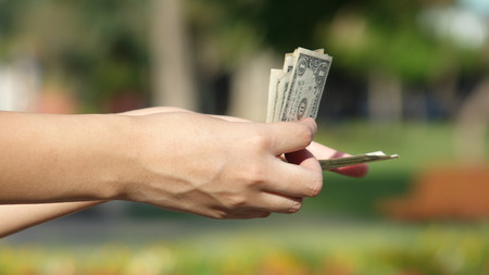 Female Hand Counting Cash Money