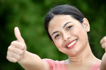 Filipina Female With Thumbs Upの写真素材