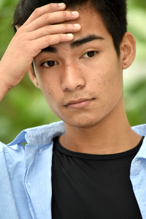 Anxious Young Filipino Maleの写真素材