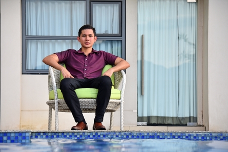 Handsome Male Man Sitting By Pool