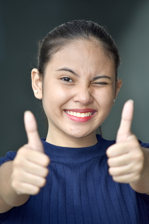 Teen Girl With Thumbs Upの写真素材